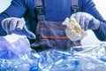 Worker sorting plastic garbage for recycling. Process plastic polymers sorting. Ecology