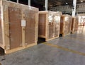 Worker sorting shipment cartons box on pallets and wooden case on hand lift in interior warehouse cargo for export and sorting goo