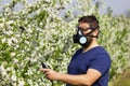 Worker spraying cherry tree