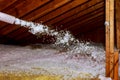 Worker Spraying mineral rock wool of house attic insulation Royalty Free Stock Photo