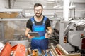 Worker with stamping foil rolls at the manufacturing Royalty Free Stock Photo