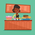 Worker standing behind the counter at the bakery. Royalty Free Stock Photo