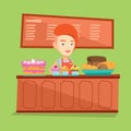 Worker standing behind the counter at the bakery. Royalty Free Stock Photo