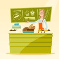 Worker standing behind the counter at the bakery. Royalty Free Stock Photo