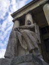 Worker statue on the background of Palace of Culture and Science in Warsaw