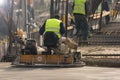 Worker with Concrete Pavements machine at the constructio site