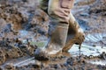 worker in steeltoe boots walking through construction mud Royalty Free Stock Photo