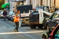 Worker stopping traffic for construction in Bucharest, Romania, 2019
