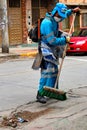 Man sweeping the streets in the capital of colombia