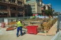 Worker sweeping the floor on construction site in Madrid Royalty Free Stock Photo