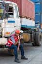 Worker taking a rest on Truck and Dinking water. Royalty Free Stock Photo