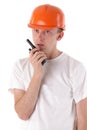 Worker talking on portable UHF radio transceiver Royalty Free Stock Photo