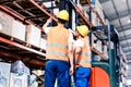 Worker team taking in logistics warehouse