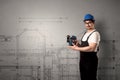 Worker with technical drawing.