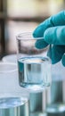 A worker testing the quality of drinking water in a laboratory.