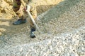 worker throws rubble with a shovel