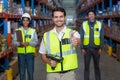 Worker with thumb up wearing yellow safety vest Royalty Free Stock Photo