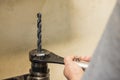 The worker tighten the drill tool to the holder Royalty Free Stock Photo