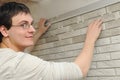 Worker tiler at wall decoration