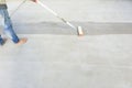 Worker to skim coat surface of concrete pavement floor or slab Royalty Free Stock Photo