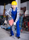 Worker to work with demolition hammer
