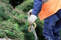 worker touches the crane hooks to the loops in the concrete slab during repair work.