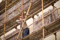 Worker in traditional Chinese scaffolding