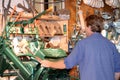 Worker in a traditional wooden shoe factory