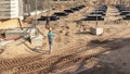 A worker transfers elements for the installation of the formwork at the construction site. Monolithic concrete formwork during the Royalty Free Stock Photo