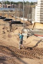 A worker transfers elements for the installation of the formwork at the construction site. Monolithic concrete formwork during the Royalty Free Stock Photo