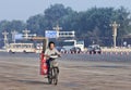 Worker transports gauze rolls on his electric bike, Beijing, China