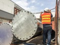 Worker on truck with big metal pipe,The man wear Reflective clothing and safety helmet,Contractor job