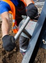 Worker turning the T-wrench