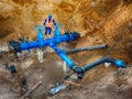 Worker underground at gate valve on drink water system, waga multi joint members. Royalty Free Stock Photo