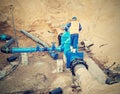 Worker underground for reconstrucion of drink water system. Technical expert at gate valve Royalty Free Stock Photo
