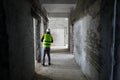 Worker in an unfinished building on a hospital construction site Royalty Free Stock Photo