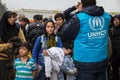 Worker of the UNHCR, the United Nations Agency for refugees, managing a crowd of youg women at the border between Serbia & Croatia