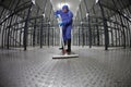 Worker uniform cleaning floor in storehouse Royalty Free Stock Photo