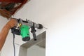 Worker use driller for drill wall Royalty Free Stock Photo