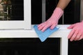Worker use a soft cloth cleaning PVC aluminum window frames remove a small dirty. Royalty Free Stock Photo