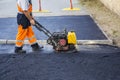 Worker use vibratory plate compactor Royalty Free Stock Photo