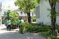 Worker uses a brush collection truck to pick up of debris from a tree that was cut down