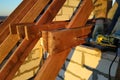 The worker uses a drill in the construction of the roof Royalty Free Stock Photo