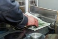 worker uses his hands to make the final polishing of stainless steel parts at a metal products manufacturing plant Royalty Free Stock Photo