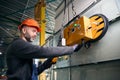 Worker uses modern equipment in a production workshop