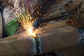 A worker uses a oxygen acetylene cutting