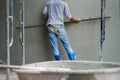 Worker uses the trowel for plastering the brickwork wall by mixed cement Royalty Free Stock Photo