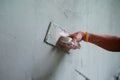 Worker uses the trowel for plastering the brickwork wall by mixed cement Royalty Free Stock Photo