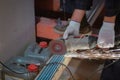 Worker is using angle grinder with fountain of sparks in apartment that is under construction, remodeling, renovation Royalty Free Stock Photo