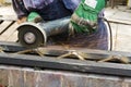 Worker using angle grinder